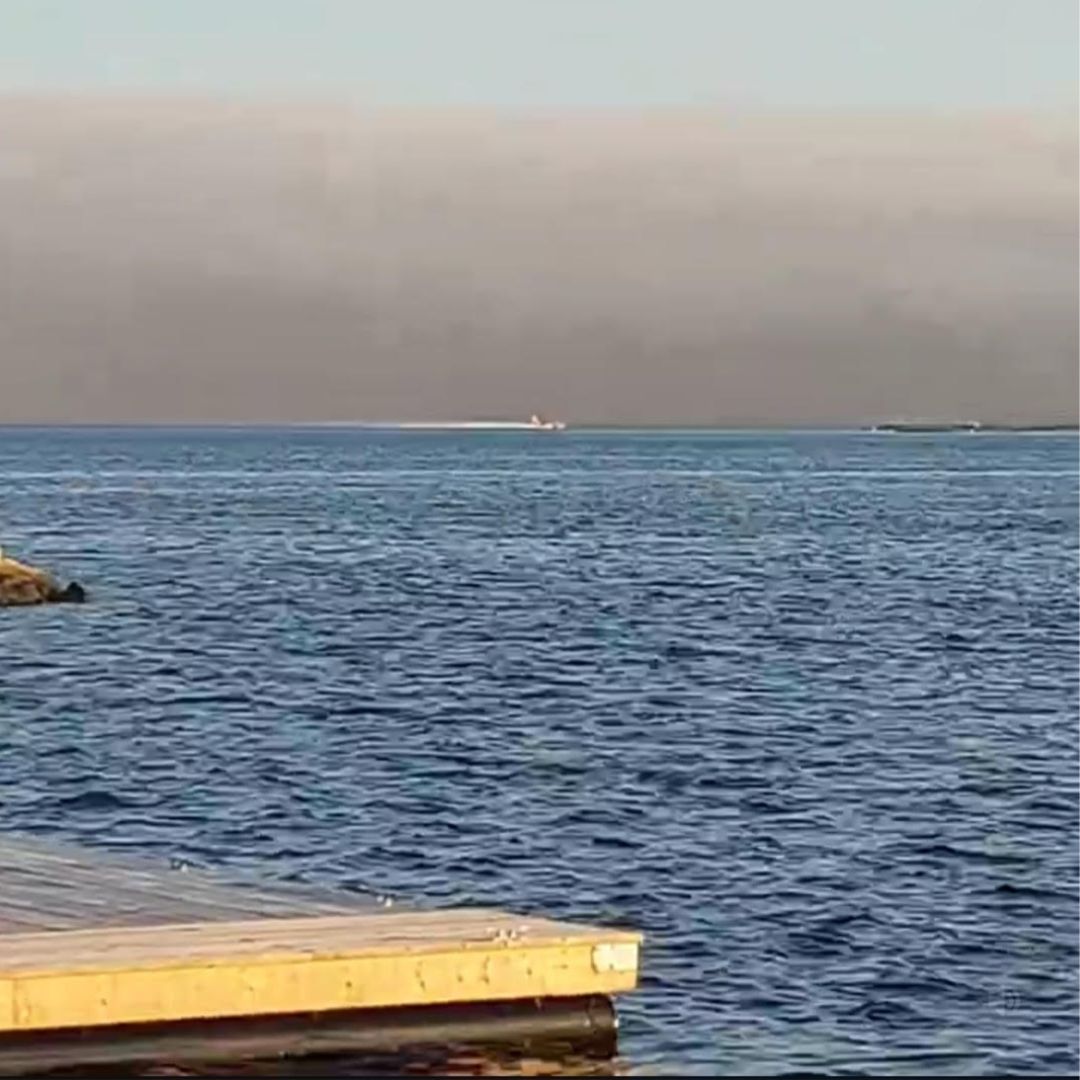 Water Bombers scooping up water against the Barrington and Lake Rd Fire in 2023.